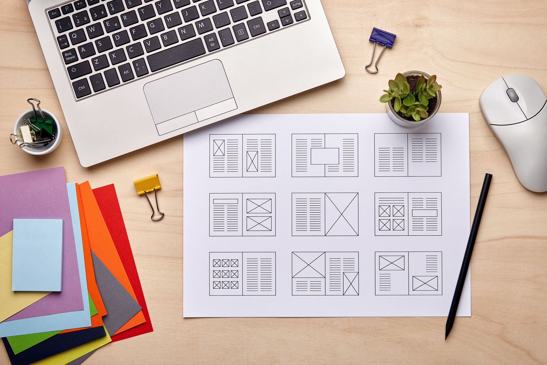 Editorial designer desk with publication layout